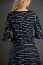Load image into Gallery viewer, Back view of lady wearing The A-Line Dress, shows a Centre Back seam with concealed zipper fastening
