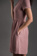 Load image into Gallery viewer, Close up of side view of Day Dress showing lady&#39;s hand in pocket.
