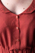 Load image into Gallery viewer, Close up of lady&#39;s dress showing chest and collar made with Dottie Terracotta Viscose fabric
