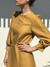 Load image into Gallery viewer, Close up of Zenith dress top shows sunray pleats from the centre front of the waistline.
