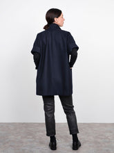 Load image into Gallery viewer, Back view of lady wearing Cap Sleeve Vest with hands in front patch pockets at hip level
